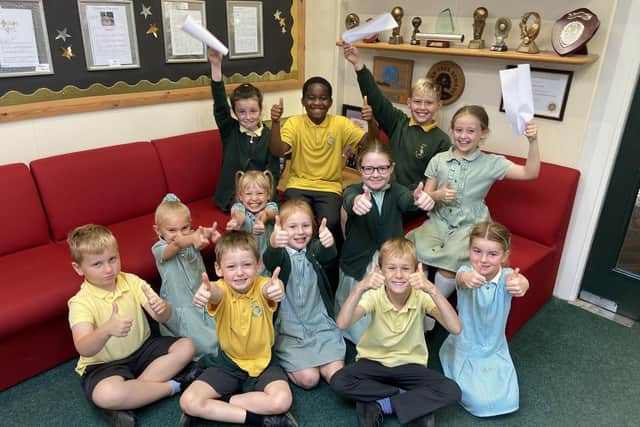 Fens Primary School pupils celebrate the outcome of their recent Ofsted report.