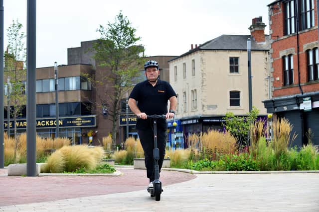 Marty Fishwick riding an electric scooter in  Church Square after the launch of the electric scooter Scheme in Hartlepool. Picture by FRANK REID