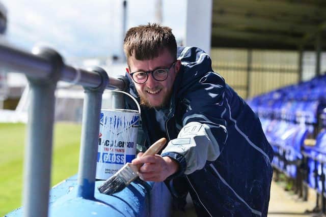 Hartlepool United fan Adam Davison gives Victoria Park a lick of paint ahead of Saturday's game. Picture by FRANK REID