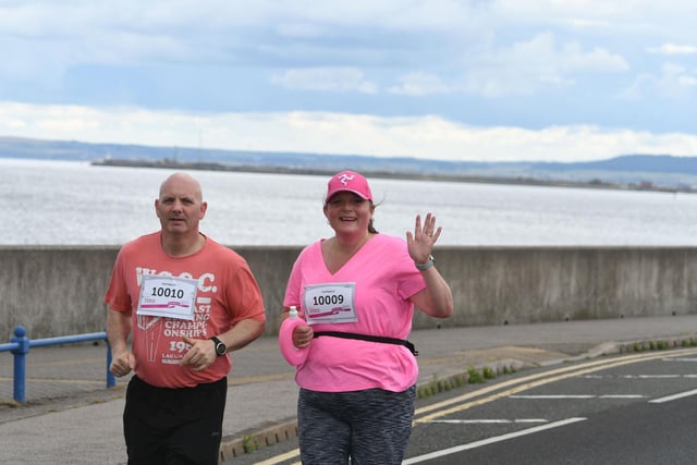 Runner waves at the camera during the Race for Life in Hartlepool on Sunday, July 3.