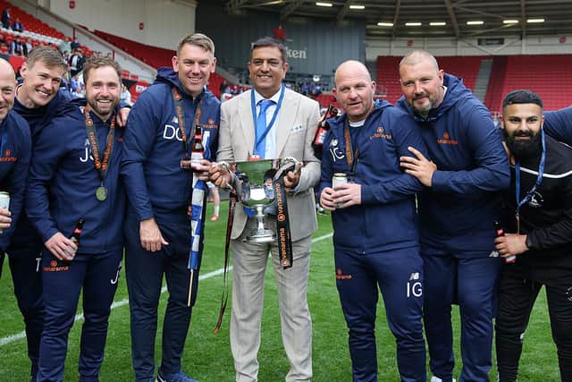 Hartlepool United chairman Raj Singh with the club's coaching staff following the play-off final win over Torquay United in June (photo: Frank Reid)
