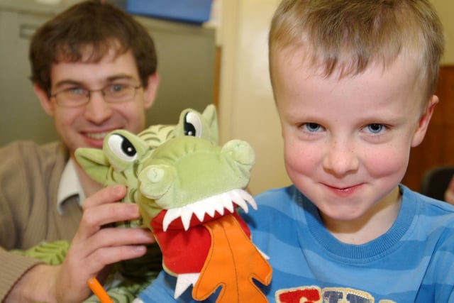 Paul Towell, children's librarian, with Finn O'Leary-Thompson, aged five and dragon friend at activities at Worksop Library.