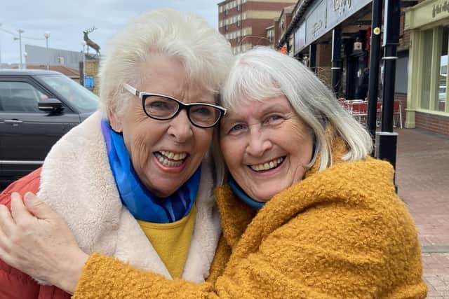 Pat Edgar and friend Pauline hug on reopening day in Hartlepool. Picture by FRANK REID