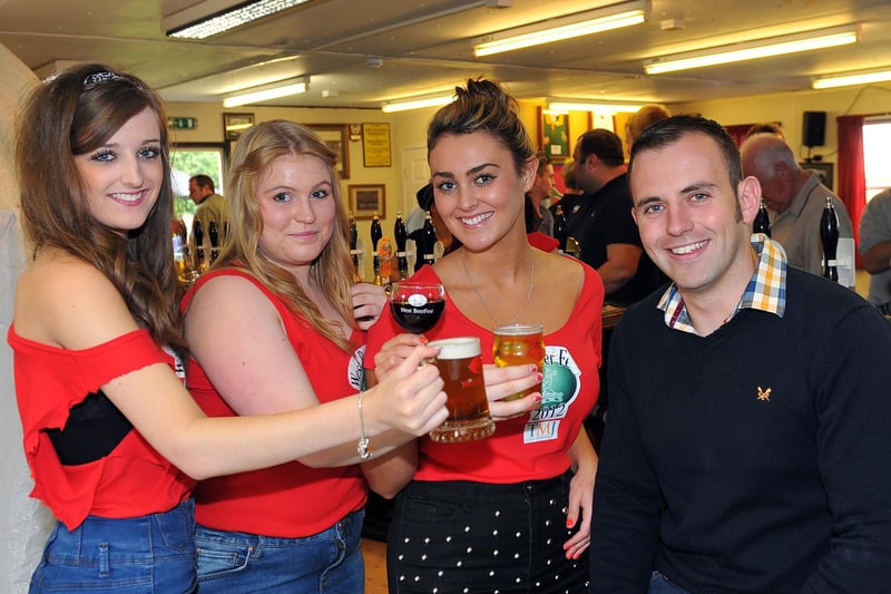 West Hartlepool Rugby Club member Chris Young is spoilt for choice of drinks on offer from barmaids Mel Flay, Jessica Simpson and Jasmine Sharp at the West Hartlepool Rugby Club Beer Fest in 2012. Picture by Frank Reid