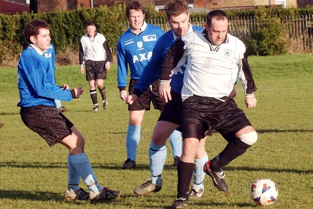The Hourglass football team, in blue, take on the Gillens Arms in 2008.