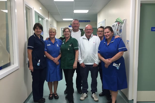Dwane Douglas and Brian Minton with staff at the University Hospital of Hartlepool's chemotherapy unit.