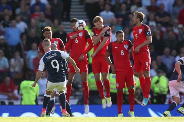 Scotland's Leigh Griffiths scores a free kick during their last game against England; a 2-2 draw at Hampden Park in 2017. PA image.