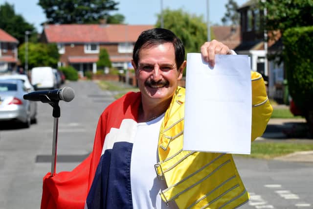 Freddie Mercury impersonator Billy West with his poem about Hartlepool United. Picture by FRANK REID