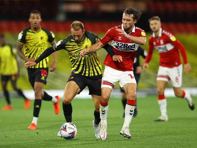 WATFORD, ENGLAND - SEPTEMBER 11: Glenn Murray of Watford battles for possession with Jonathan Howson of Middlesbrough during the Sky Bet Championship match between Watford and Middlesbrough at Vicarage Road on September 11, 2020 in Watford, England. (Photo by Richard Heathcote/Getty Images)