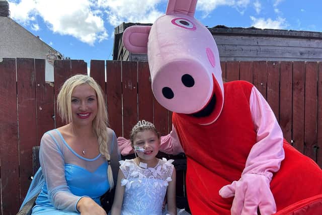 Keisha Watson with Princess Elisha (Claire Dolan) and Peppa Pig. Picture by Frank Reid