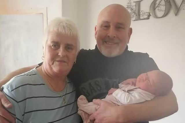 Ally with her partner Shaun Mathieson and a member of their extended family in 2024.