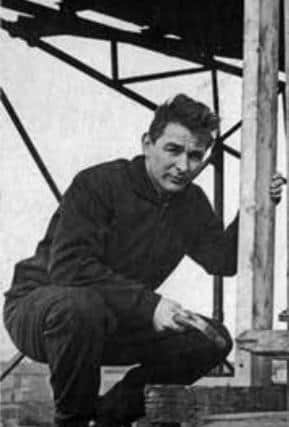 A photo from the book showing Brian Clough painting the stands at Hartlepool.