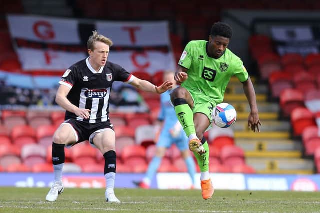 Luke Hendrie of Grimsby Town attempts to win the ball from Devante Rodney of Port Vale during the Sky Bet League Two match between Grimsby Town and Port Vale at Blundell Park (Photo by Ashley Allen/Getty Images)