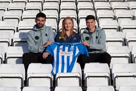 Hartlepool footballers Jack Hunter and Jamie Miley with University Hospitals Tees’ education and training partner Teresa Pounder.