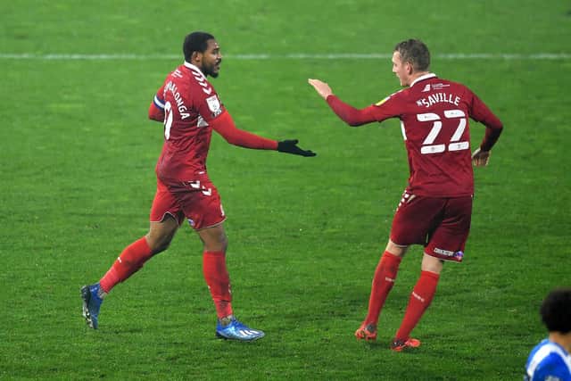 HUDDERSFIELD, ENGLAND - NOVEMBER 28: Britt Assombalonga of Middlesborough celebrates with teammate George Saville after scoring his team's second goal during the Sky Bet Championship match between Huddersfield Town and Middlesbrough at John Smith's Stadium on November 28, 2020 in Huddersfield, England. (Photo by Gareth Copley/Getty Images)