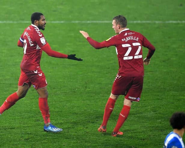 HUDDERSFIELD, ENGLAND - NOVEMBER 28: Britt Assombalonga of Middlesborough celebrates with teammate George Saville after scoring his team's second goal during the Sky Bet Championship match between Huddersfield Town and Middlesbrough at John Smith's Stadium on November 28, 2020 in Huddersfield, England. (Photo by Gareth Copley/Getty Images)