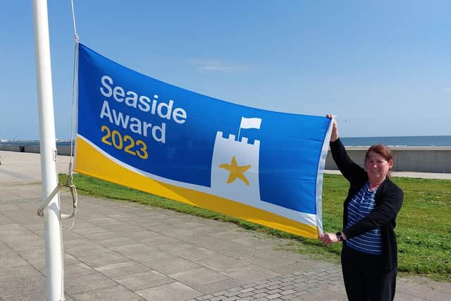 Debbie Kershaw, Hartlepool Borough Council’s quality and safety officer, raises the Seaside Award flag at Seaton Carew.