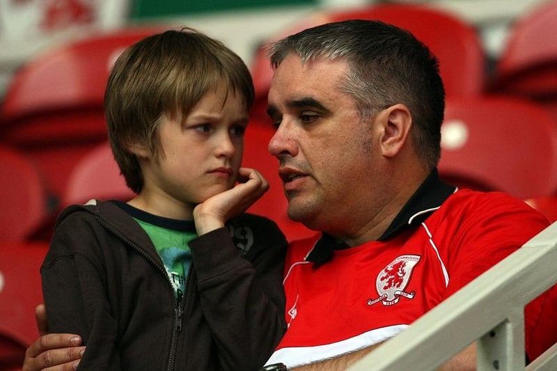A young Middlesbrough fan and his father react after the final whistle of the Barclays Premier League match between Middlesbrough and Aston Villa at the Riverside Stadium.