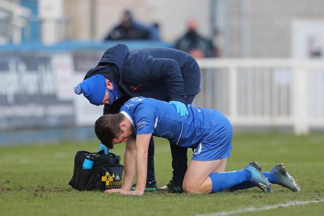 Rhys Oates receives treatment during the Vanarama National League match between Hartlepool United and Sutton United at Victoria Park, Hartlepool on Saturday 30th January 2021. (Credit: Mark Fletcher | MI News)