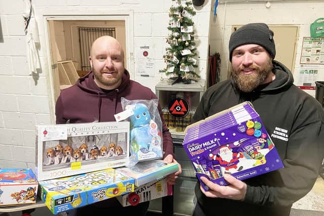Northern Strength and Performance owner Adam Marshall (right) and member James Bowden with some of the donated gifts from their Giving Tree behind them. Picture by FRANK REID
