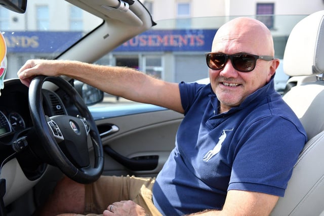 Maurice Goldbrough enjoys his convertible in Seaton this afternoon.