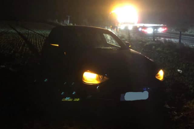 A photo shared by North Yorkshire Police of the BMW after it became stuck in a field off the A66 near Richmond.