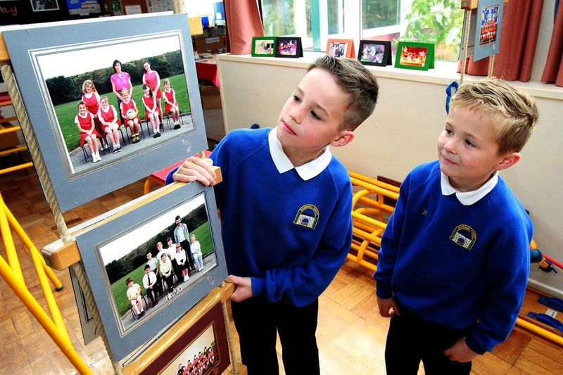 Pupils Jay French, seven, and Jay Salmons, nine, take a closer look at some of the old school photographs on display at Barnard Grove Primary School in 2015. Picture: DAVID WOOD