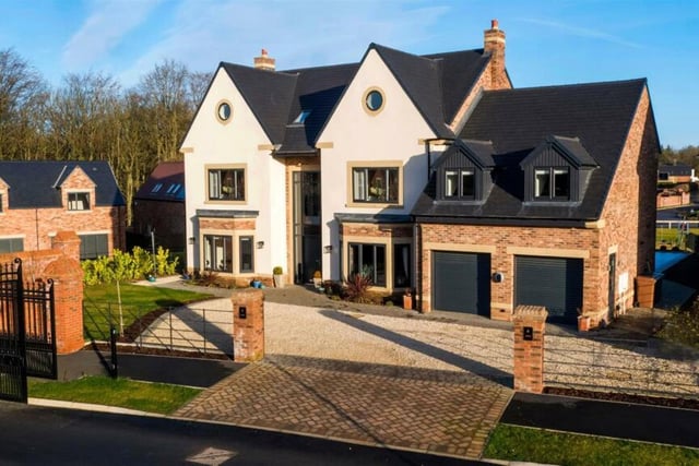 This detached home has five bedrooms, five bathrooms and is one of the largest plots in this gated development.