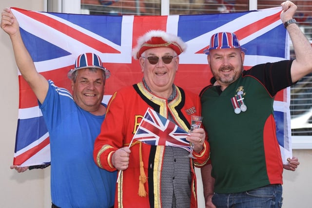 Ian Dougherty, Fred Longhorn and Jason Longhorn raise the flag on Jubilee day.