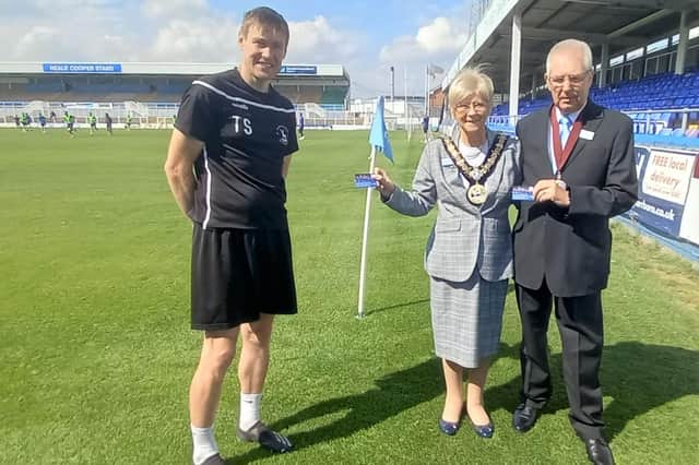 Hartlepool Mayor Councillor Brenda Loynes and Consort Councillor Dennis Loynes receive the season tickets from Hartlepool United Assistant Manager Tony Sweeney.