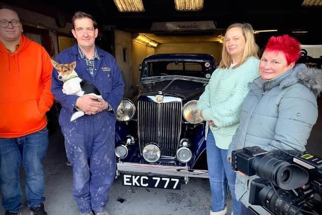 John Arkley (second left) with the 1938 MG and members of its previous owner's family during filming for Bangers and Cash: Restoring Classics.