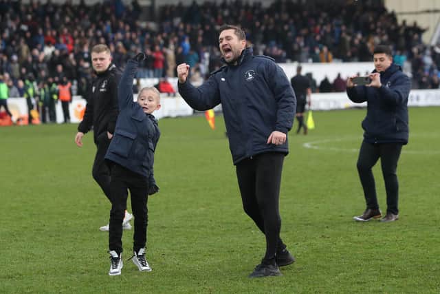 Hartlepool United manager Graeme Lee celebrates after his side's 2-1 win in the FA Cup over Blackpool. (Credit: Mark Fletcher | MI News)