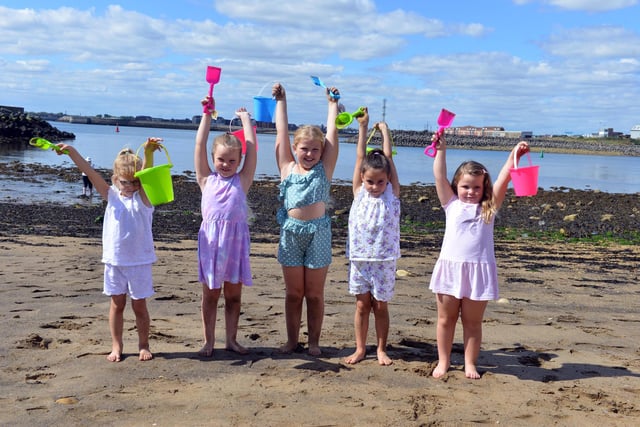 Little ones celebrating this year's sand castle competition.