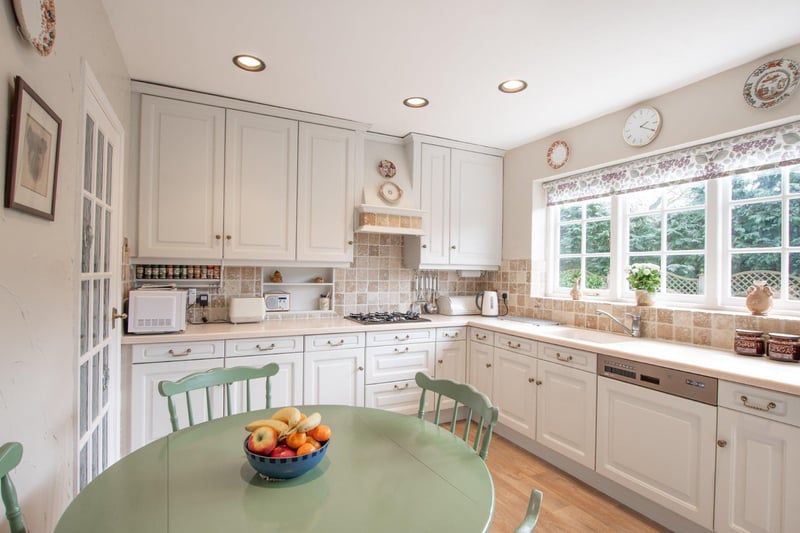 This kitchen has plenty of storage space and smart, moulded resin work surfaces.