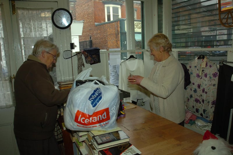 Locals shop for their bargains in Murray Street's charity shop in 2010.