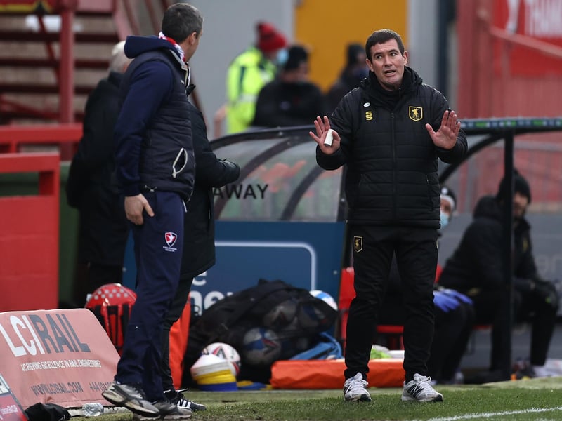 Words are exchanged betwee Nigel Clough and Cheltenham boss  Michael Duff during the FA Cup tie at Jonny Rocks Stadium.