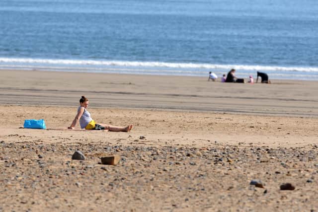 Hot weather brings people to Seaton Carew beach during governments relaxed lockdown measures