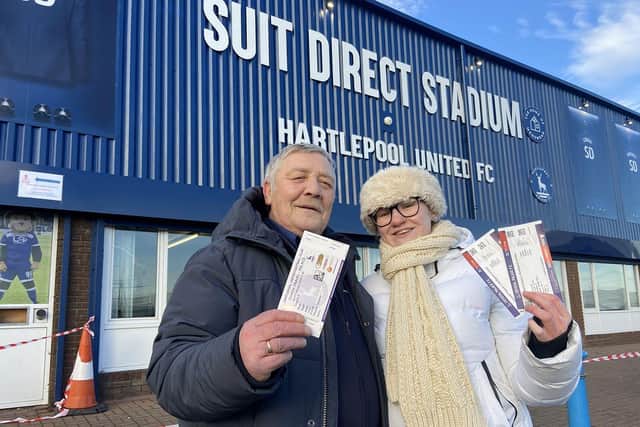 Father and daughter Derek and Elenor Thomas with their game and bus tickets for the The FA Cup 4th round game against Crystal Palace. Picture by FRANK REID