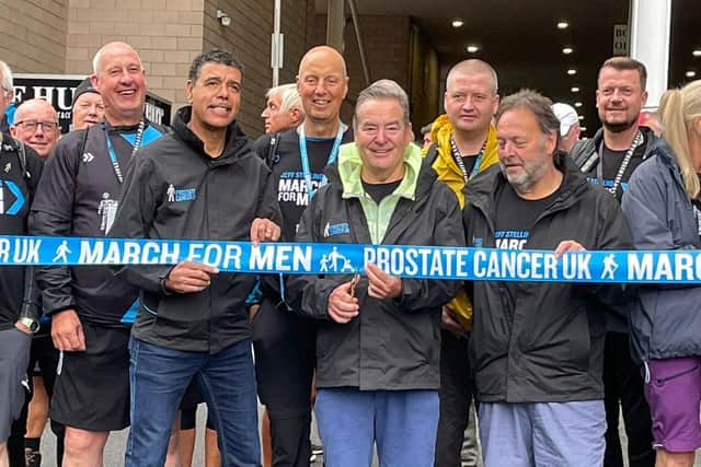Jeff Stelling, centre, cuts a ribbon to begin the start of his latest series of marathon charity walks in aid of Prostate Cancer UK.