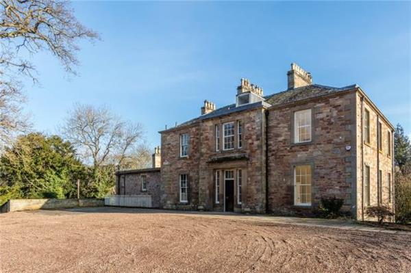 Elegant Georgian mansion set in around 12 acres of mature grounds in the Scottish Borders. Offers Over £750,000.