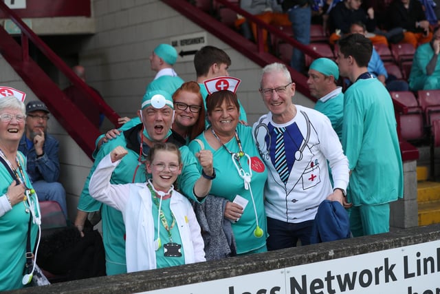 Hartlepool United supporters are all for the cause in their fancy dress efforts as doctors and nurses at Scunthorpe United. (Credit: Mark Fletcher | MI News)