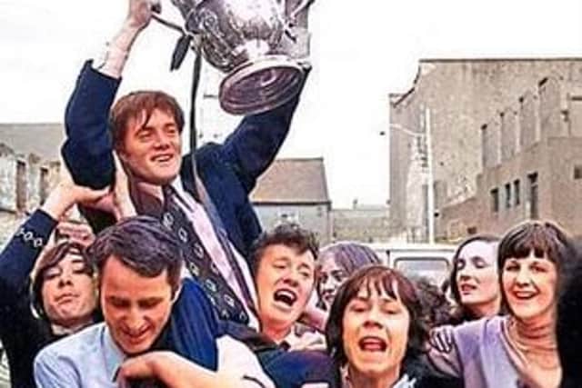 Hughie the hero with the fans celebrating in Limerick following the FAI Cup final win in 1971.