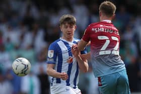 Hartlepool United's Tom Crawford in action with Scunthorpe United's Finley Shrimpton  during the League Two match at the Sands Venue Stadium. (Credit: Mark Fletcher | MI News)