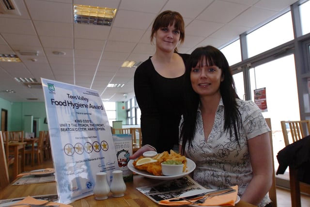Karen Campbell serves fish and chips to Debbie Campbell, the owner of The King Cod, in 2009.
