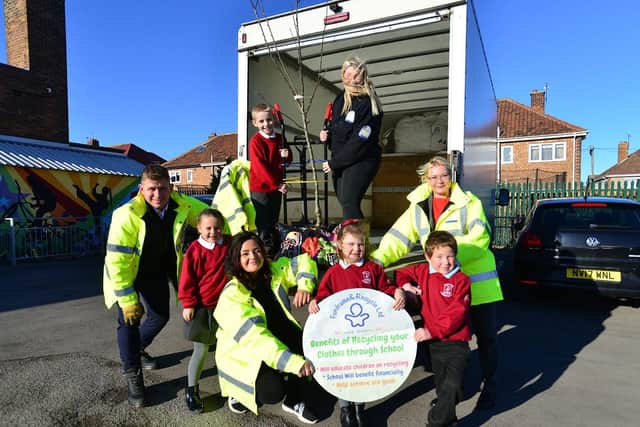 Pupil Ashton Perry helps unload the Apple Tree with Sarah Kirstopaite from Fundraising and Recycle Peterlee as fellow pupils Poppy Rowbotham, Eva Armed and Leo Robinson along with with David Kristopaotis, Racheal Dixon and Inna Ratsebarska hold there awarded certificate./Photo: Frank Reid