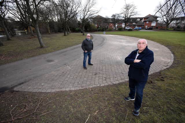Concerned Rossmere Park campaigners Peter Joyce (foreground) and Tony Richardson stand in the spot where the former bandstand used to be before it disappeared.
