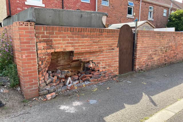 A wall was left damaged by the collision.