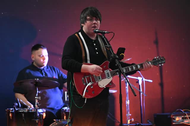 The band Shore performing at the March of the Mods in 2021.