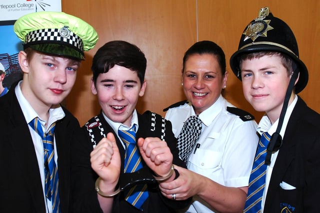 PC Tracey Stage with St Hild's School pupils (left to right) Nathan Sanderson, Tyler Bates and Cameron Anderson during the school's careers day in 2013.
