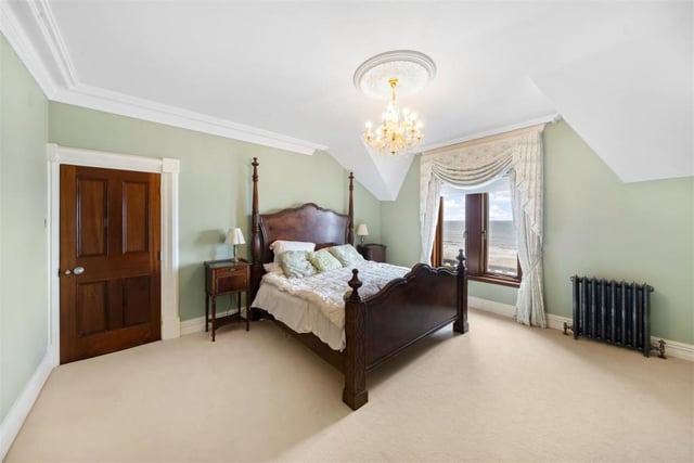 The fourth bedroom of the home has access to an en suite and a dressing room.